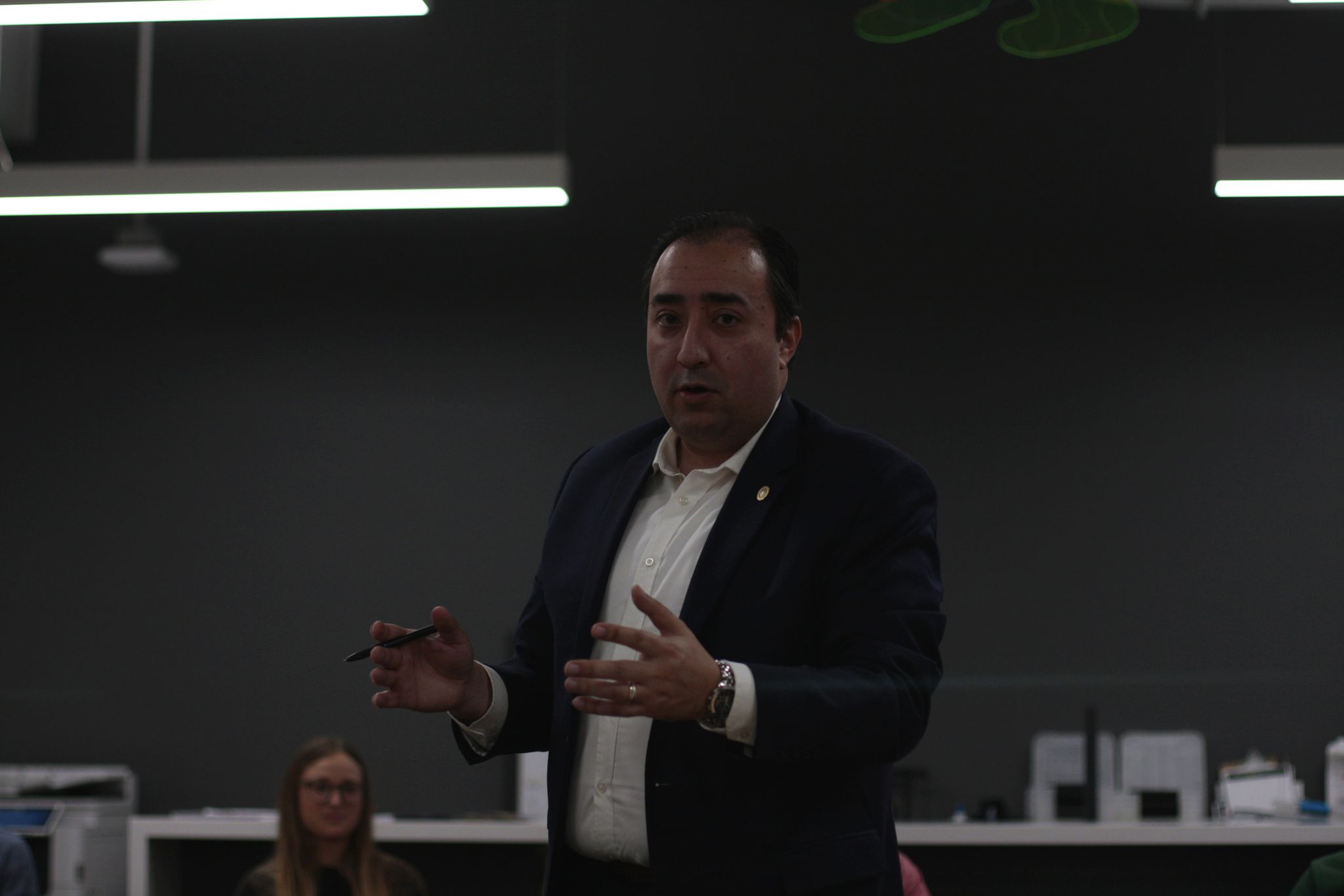 A guest speaker presenting at a Rotaract Club of Milwaukee event