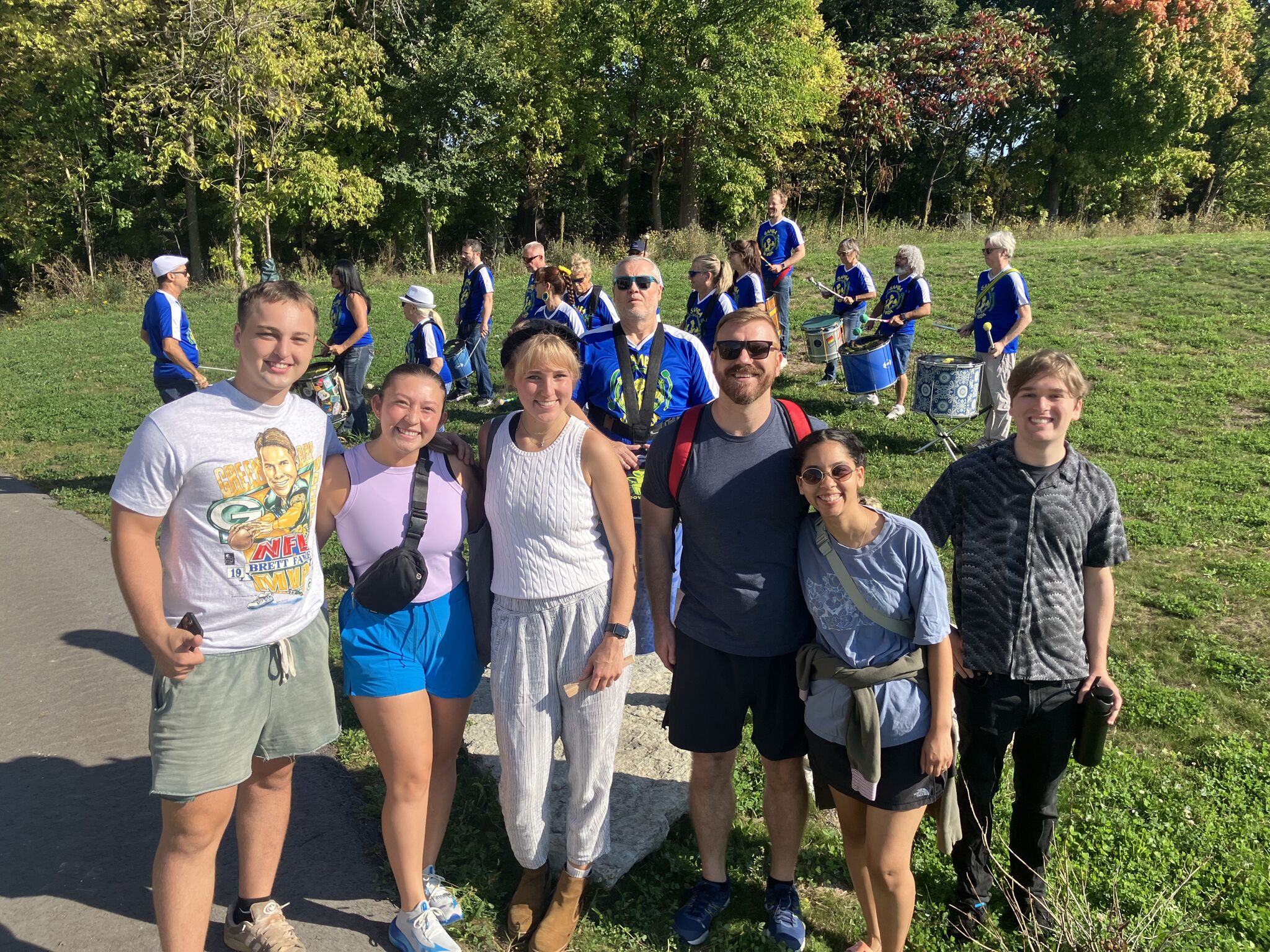 Rotaract Club of Milwaukee members with a samba drumline band at a park event