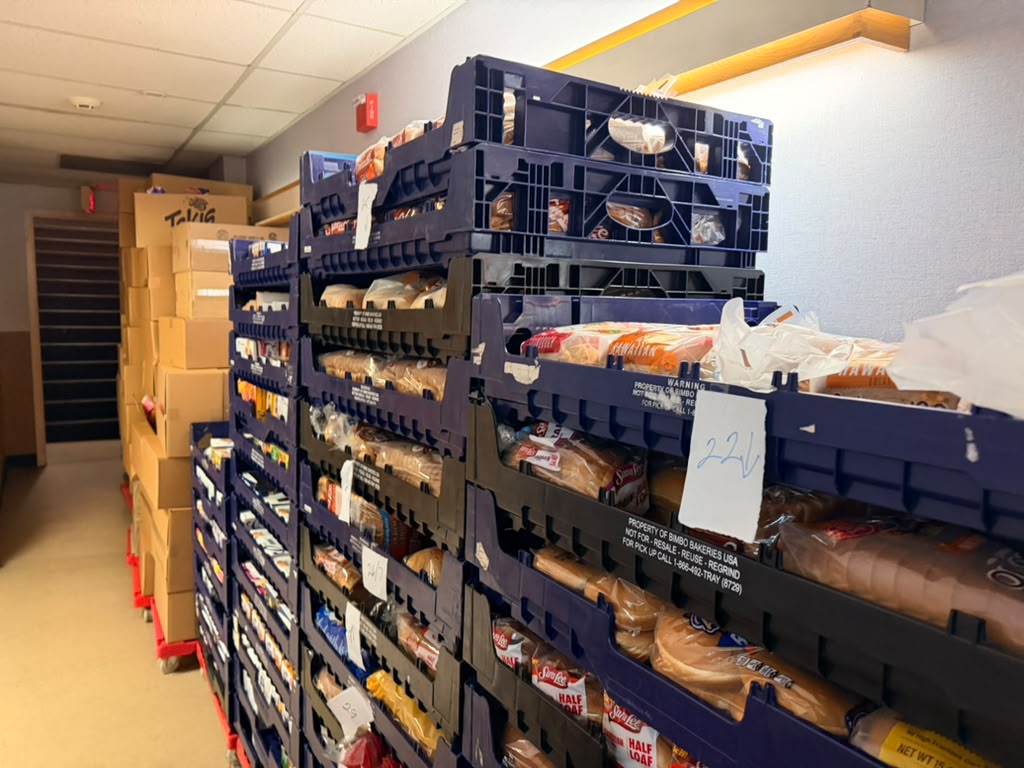 Shelves of donated bread and pantry staples at Interchange Food Pantry