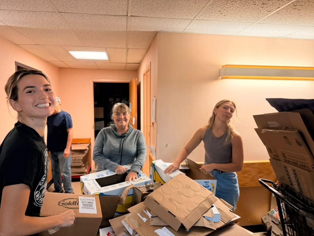 Rotaract Club of Milwaukee volunteers sorting donated pantry items at Interchange Food Pantry